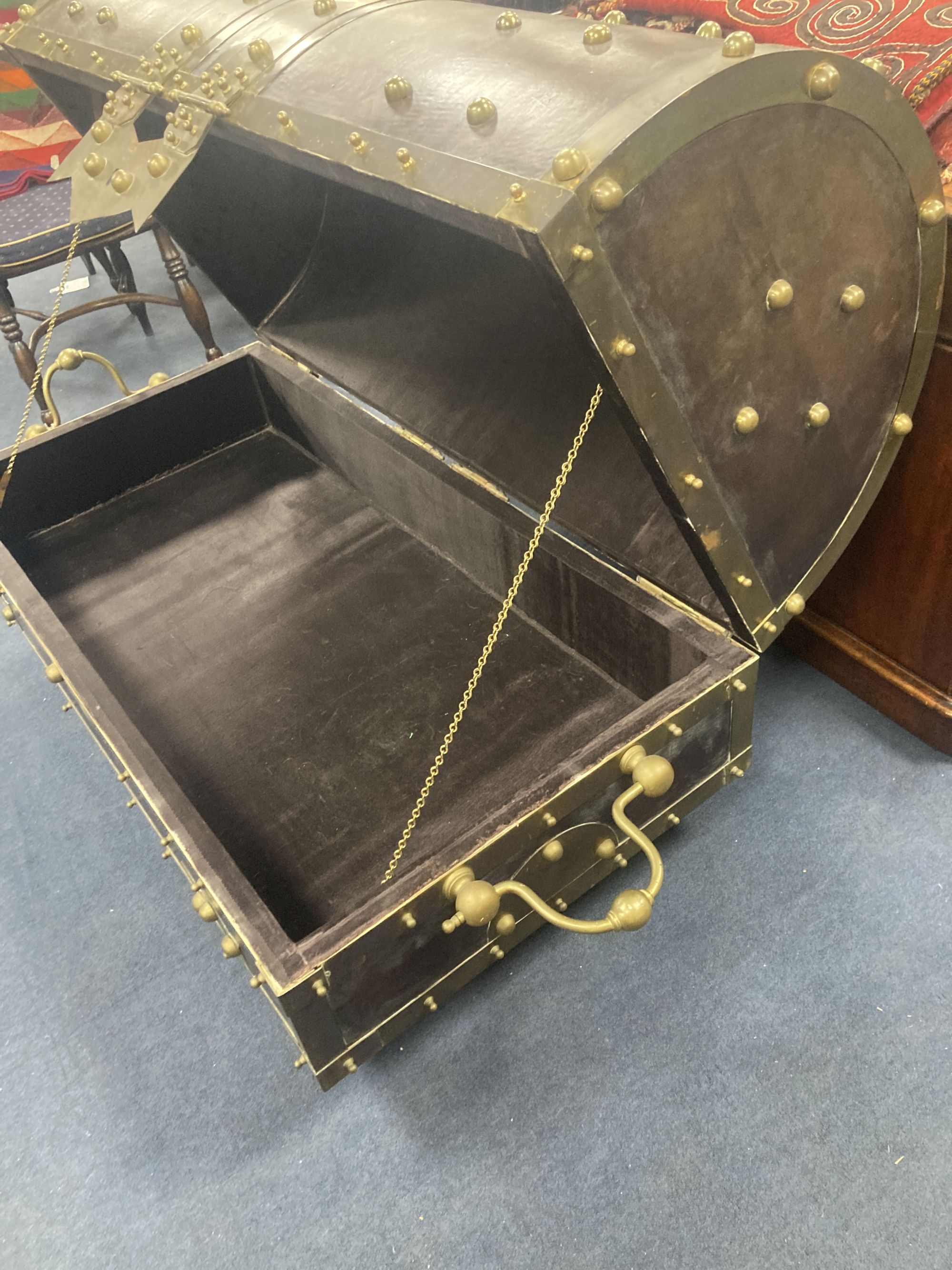 An ormolu and brass mounted leather dome top coffer,